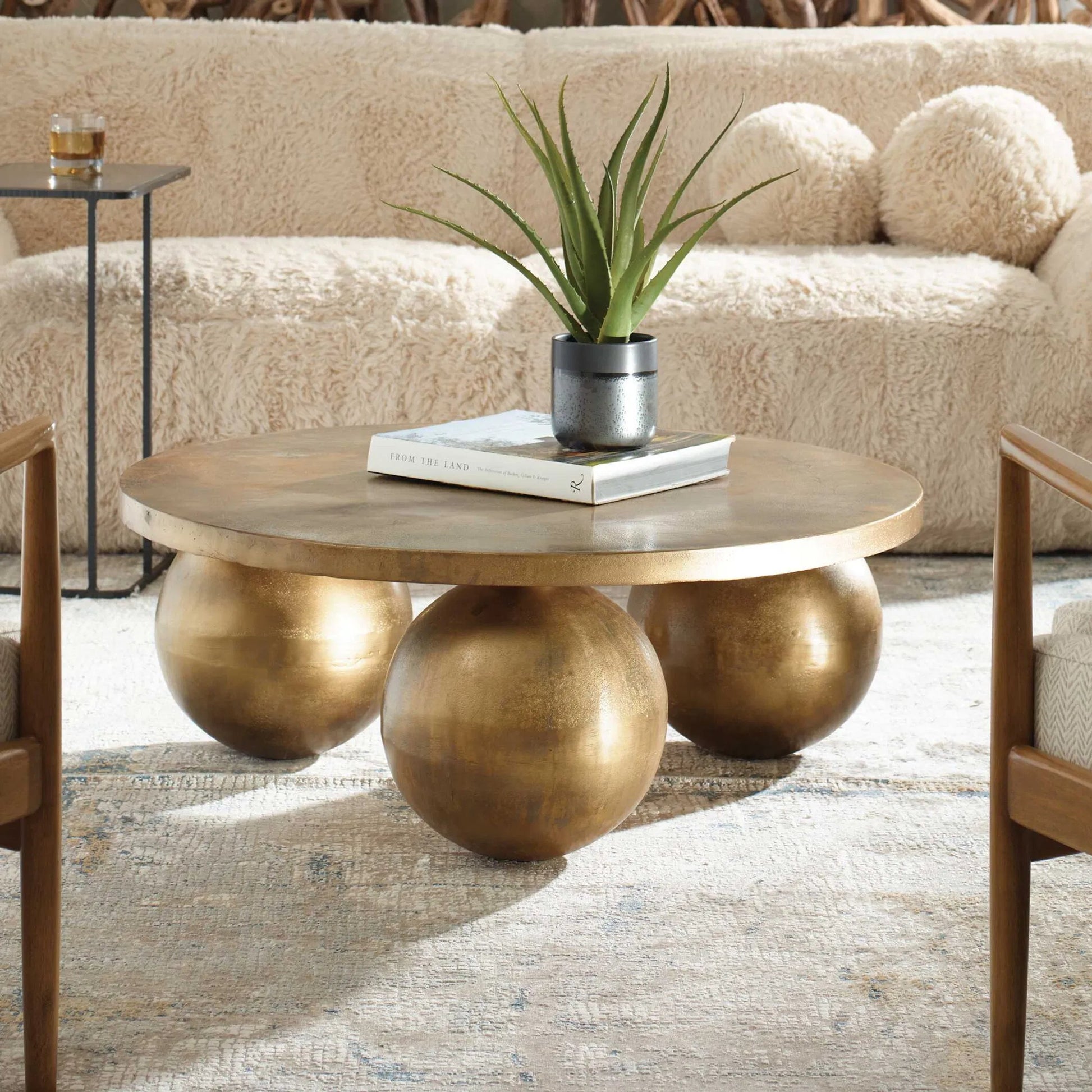 Triplet Coffee Table by Uttermost in antique brass. Made from aluminum in a modern style.