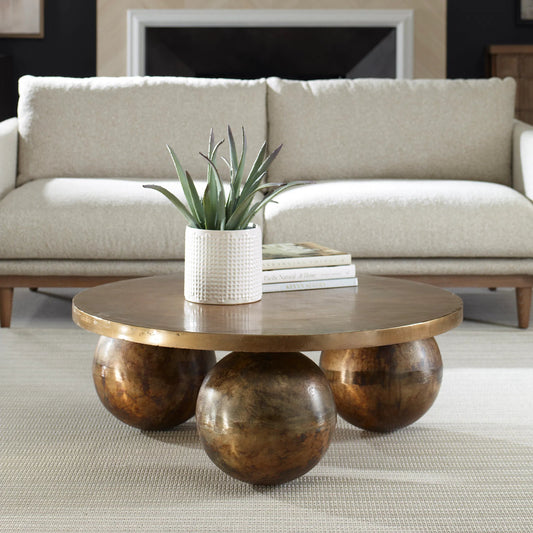 Triplet Coffee Table by Uttermost in antique brass. Made from aluminum in a modern style.