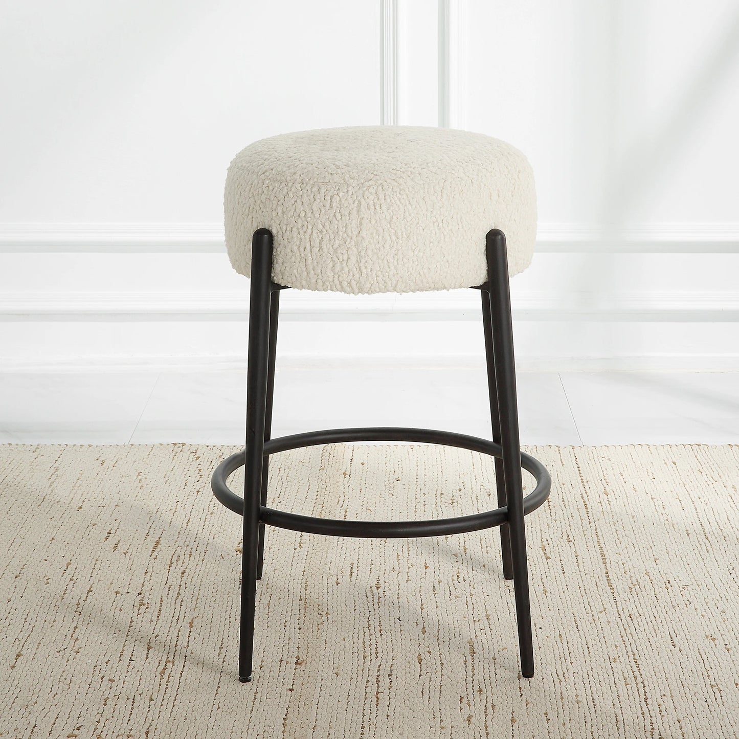006 SI-2146863 | Lifestyle | Arles Plush Counter Stool by Uttermost in white and satin black. Made from hardwood, plywood, fabric, metal, foam in a modern style.
