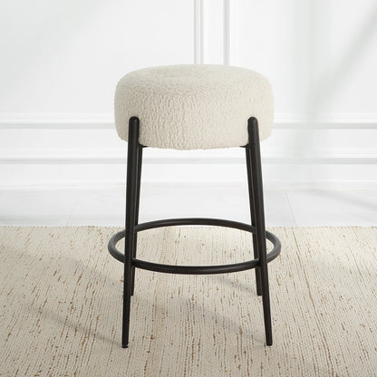 Arles Plush Counter Stool by Uttermost in white and satin black. Made from hardwood, plywood, fabric, metal, foam in a modern style.