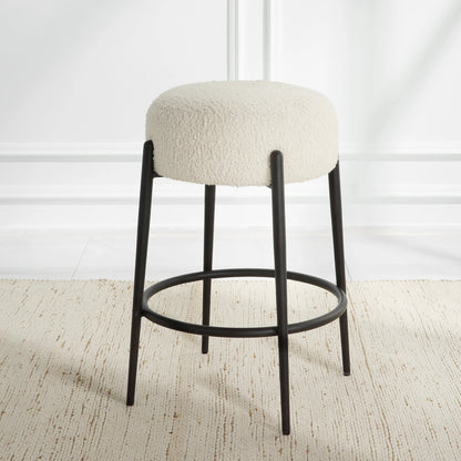 Arles Plush Counter Stool by Uttermost in white and satin black. Made from hardwood, plywood, fabric, metal, foam in a modern style.