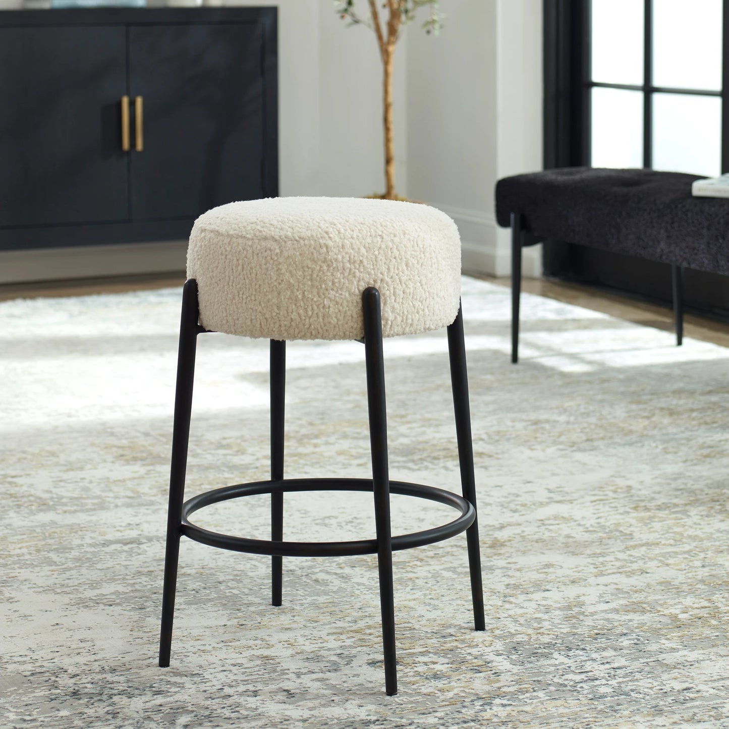 005 SI-2146863 | Lifestyle | Arles Plush Counter Stool by Uttermost in white and satin black. Made from hardwood, plywood, fabric, metal, foam in a modern style.