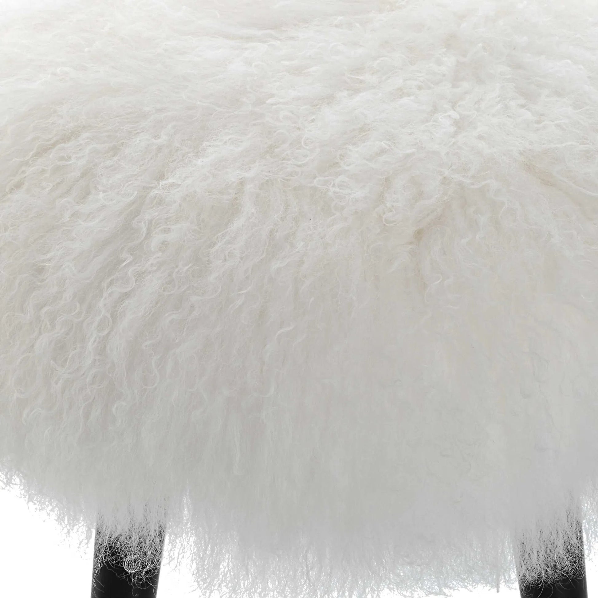 Wooly Sheepskin Accent Stool by Uttermost in black. Made from rubber wood, real sheepskin, foam, plywood in a unique style.