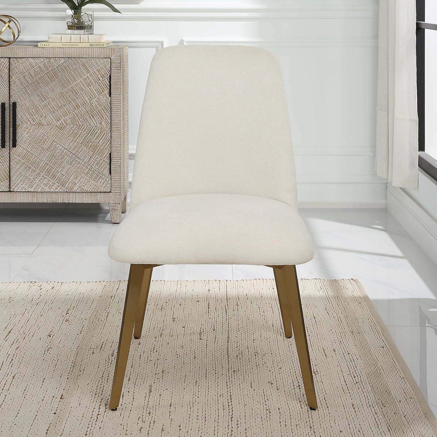 001 SI-2262242 | Lifestyle | Vantage Dining Chair by Uttermost in brass. Made from stainless steel, plywood, fabric, foam in a transitional style.