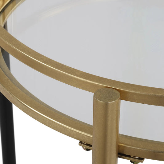 Dolly Round Bar Cart by Uttermost in gold leaf. Made from iron, tempered glass in a unique style.