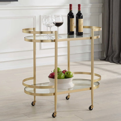 Isabelle Bar Cart by Uttermost in gold leaf. Made from iron, tempered glass in a transitional style.