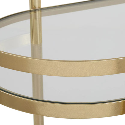 Isabelle Bar Cart by Uttermost in gold leaf. Made from iron, tempered glass in a transitional style.