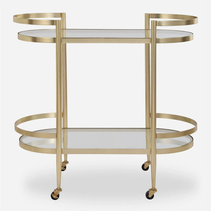 Isabelle Bar Cart by Uttermost in gold leaf. Made from iron, tempered glass in a transitional style.