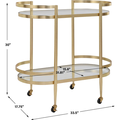 Isabelle Bar Cart by Uttermost in gold leaf. Made from iron, tempered glass in a transitional style.