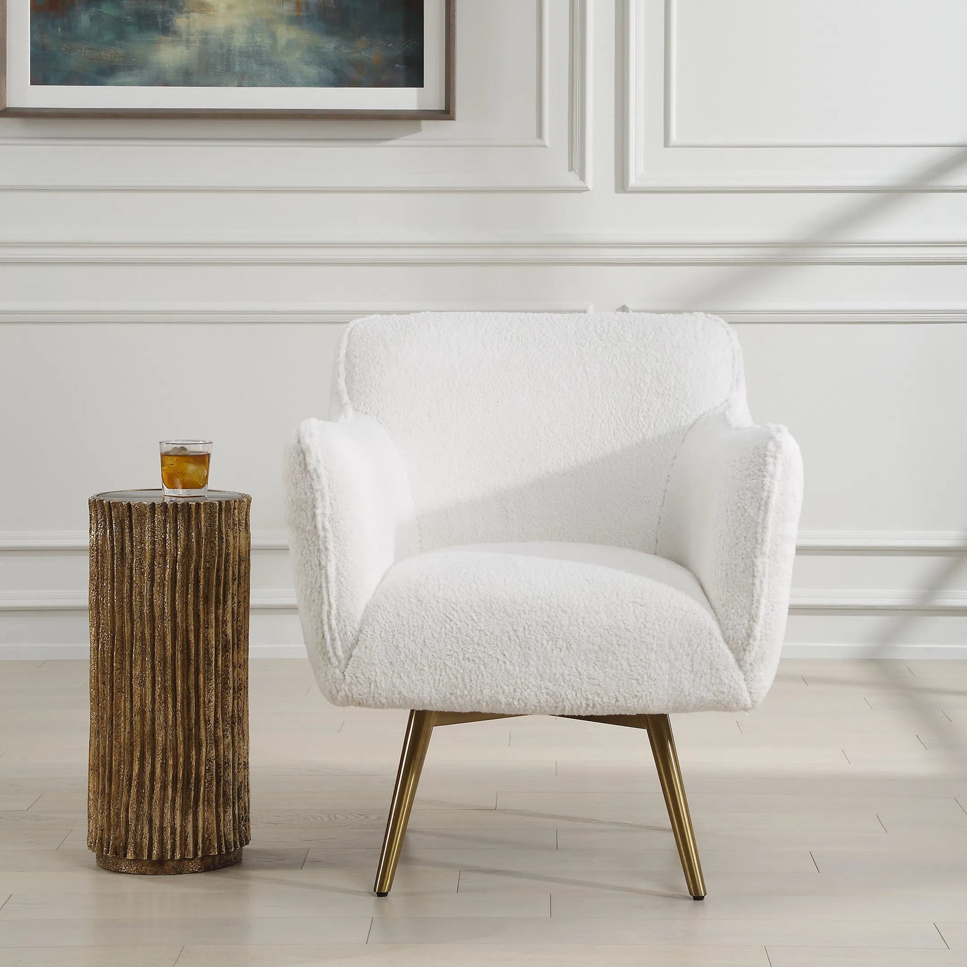 Oasis Swivel Chair by Uttermost in brass. Made from stainless steel, hardwood, plywood, fabric, foam in a transitional style.