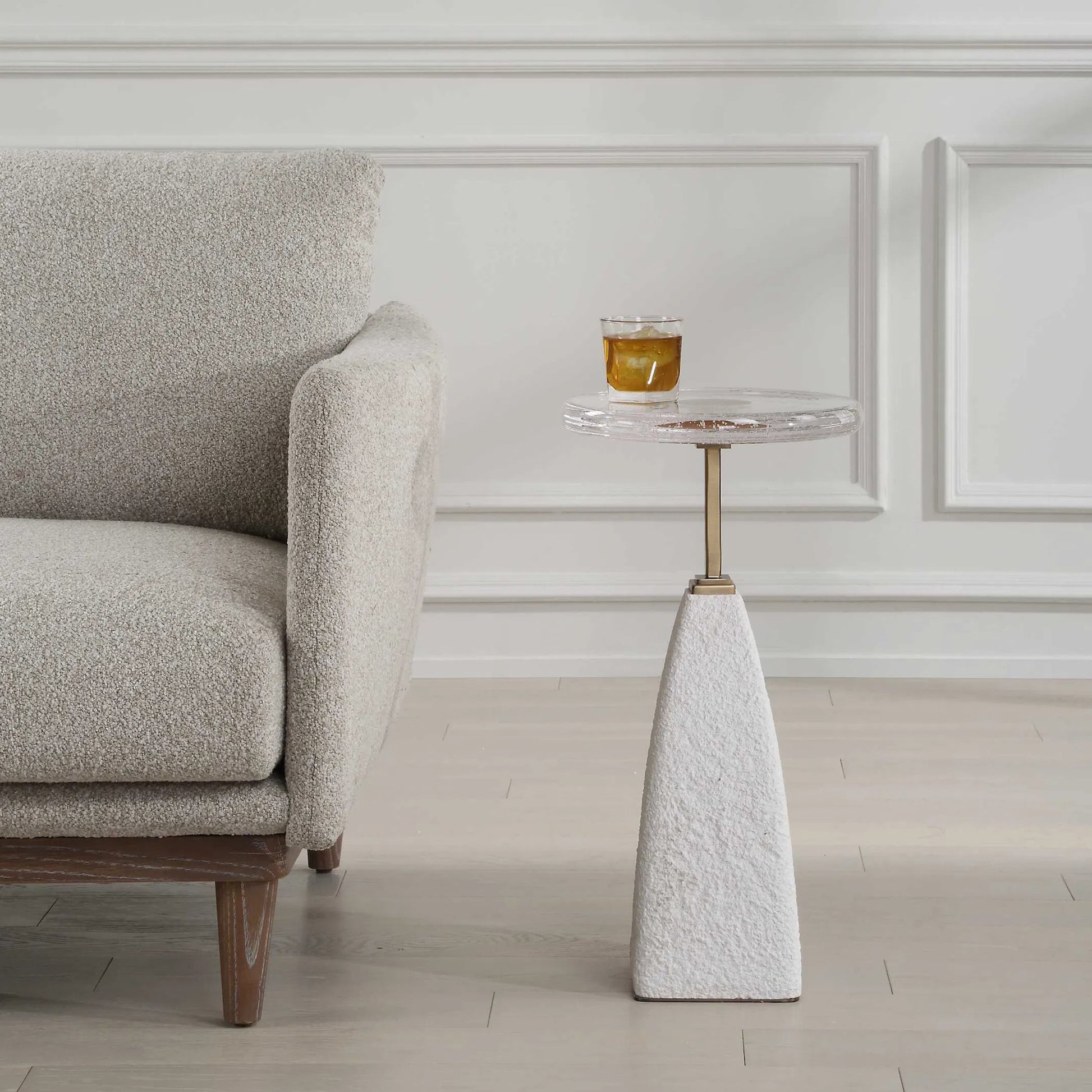 Sora Glass Drink Table by Uttermost in brass. Made from steel, sandstone, glass in a transitional style.