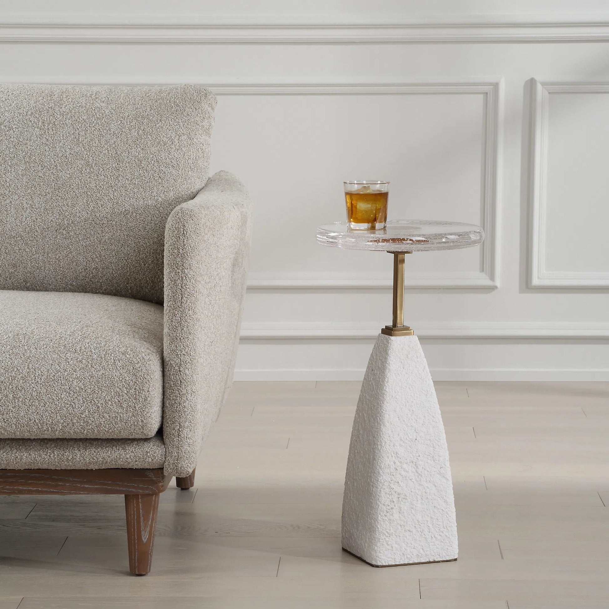 Sora Glass Drink Table by Uttermost in brass. Made from steel, sandstone, glass in a transitional style.