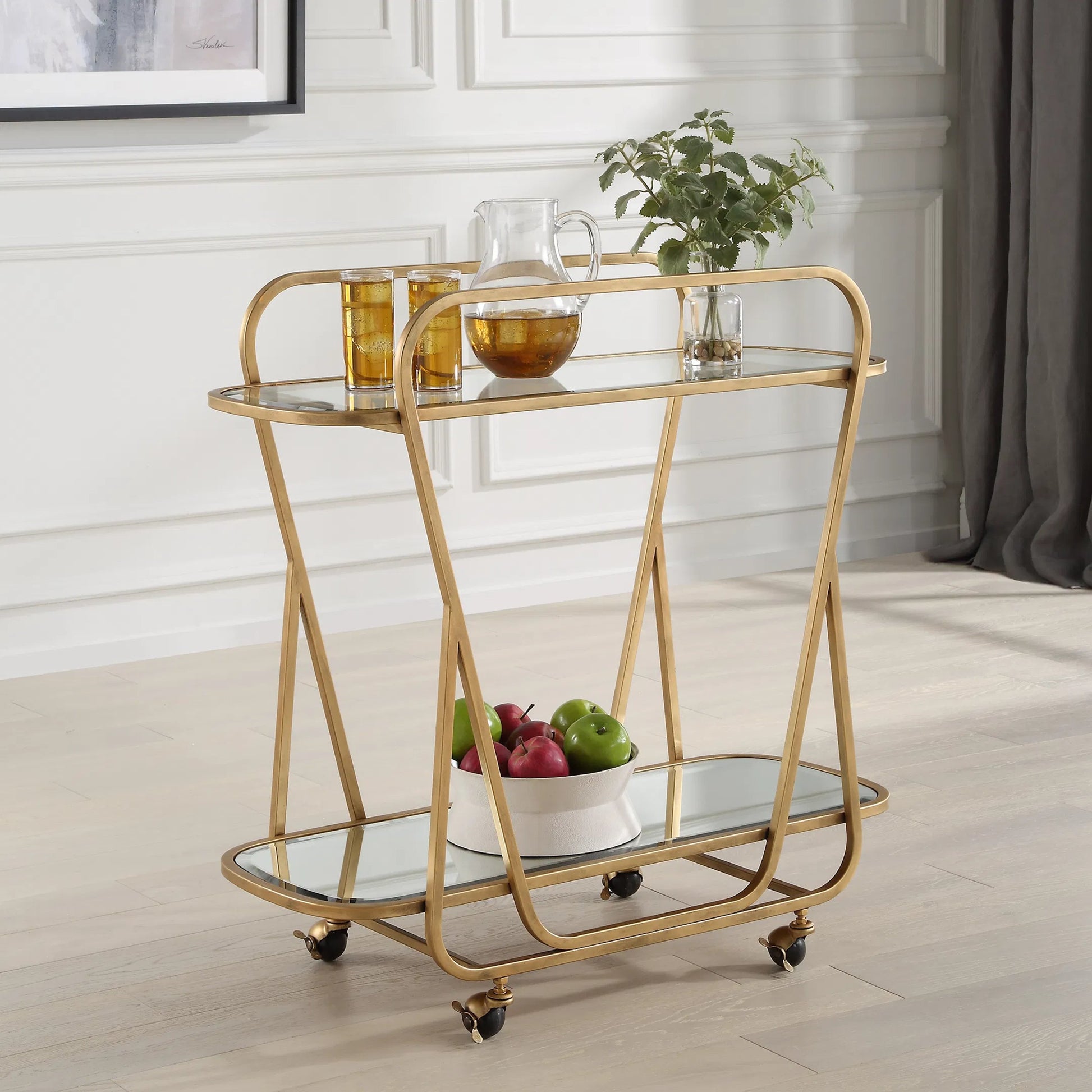 Swain Serving Cart by Uttermost in brass. Made from iron, glass, mirror in a transitional style.