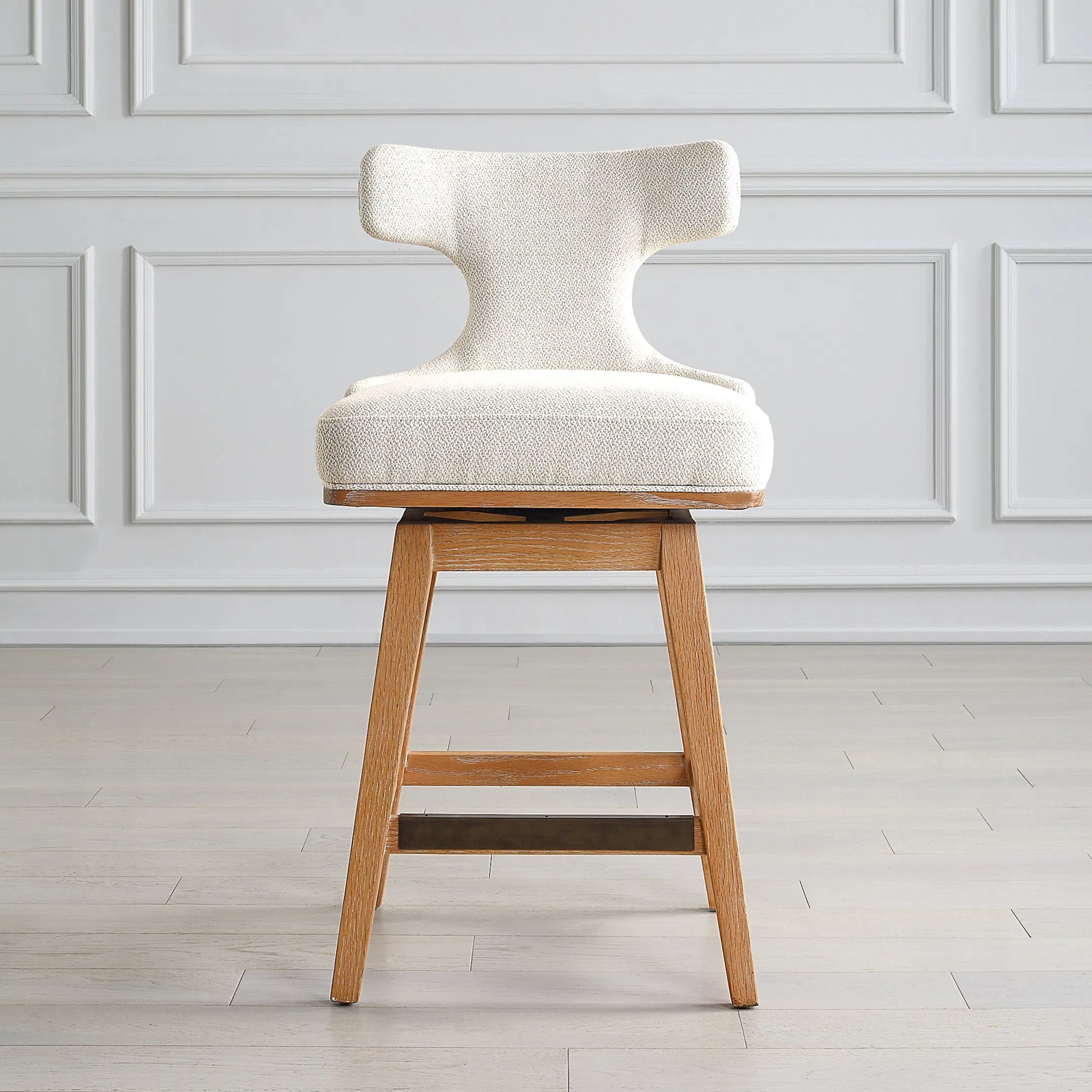 Klismos Counter Stool by Uttermost in bronze. Made from wood, foam, fabric in a transitional style.