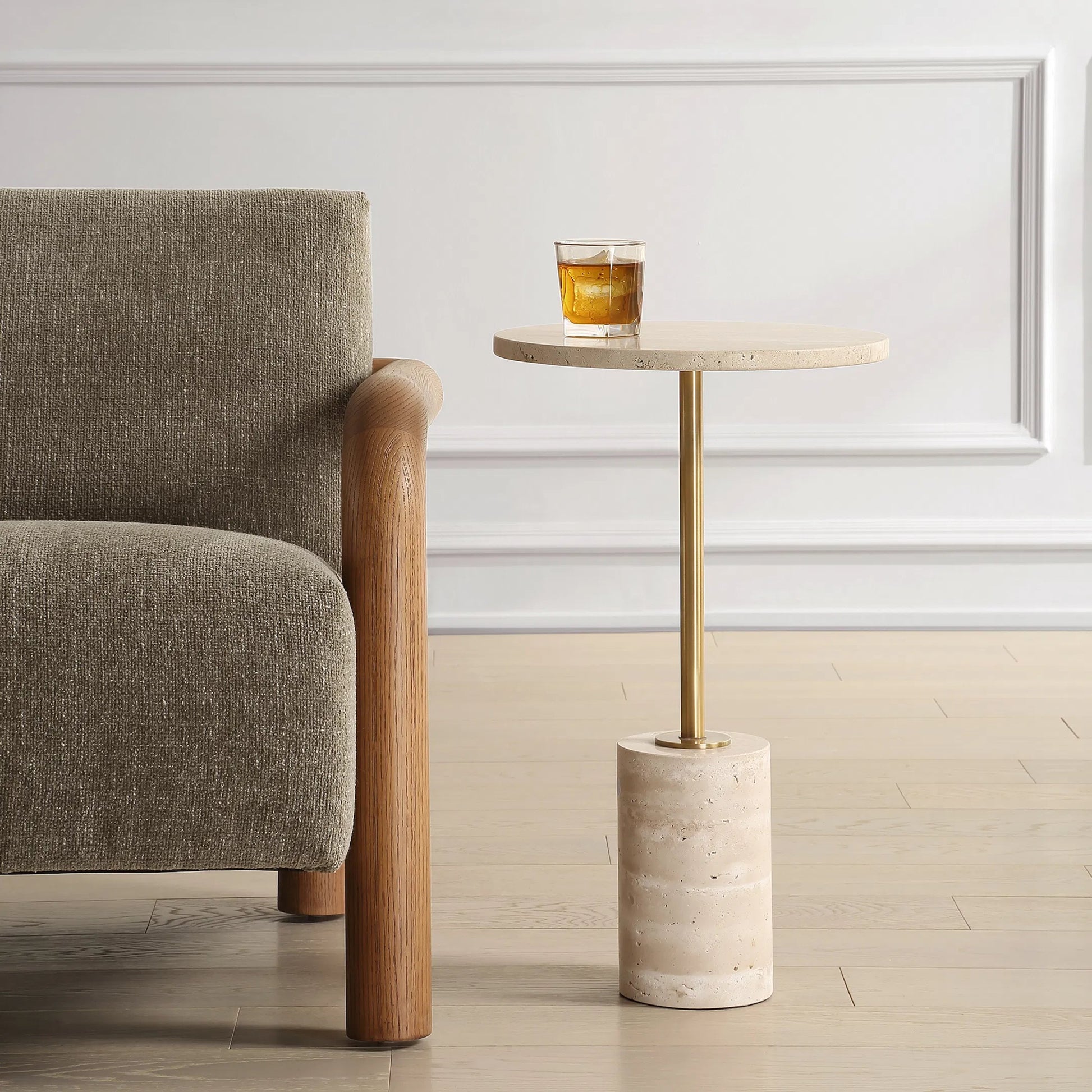 Malya Travertine Accent Table by Uttermost in brass. Made from travertine, metal in a unique style.