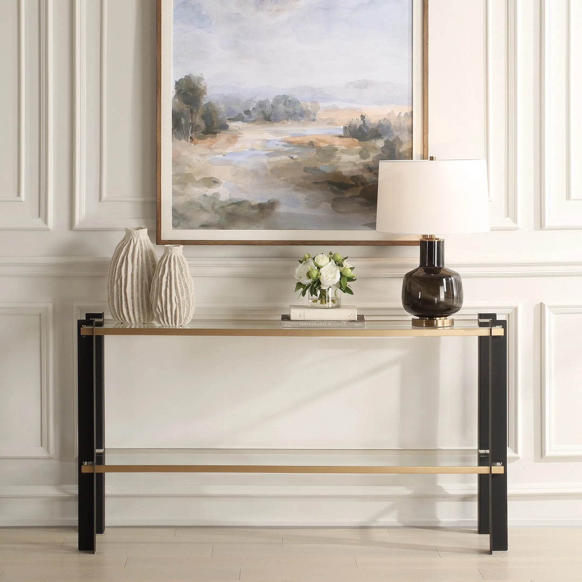 Cunene Contemporary Console Table by Uttermost in gold leaf. Made from metal, glass in a modern style.