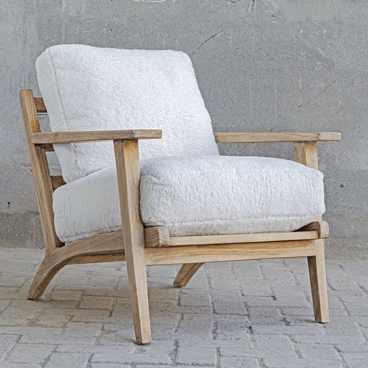 Laid Back Sheepskin Accent Chair by Uttermost in white. Made from mindi wood, fabric bopep in a unique style.