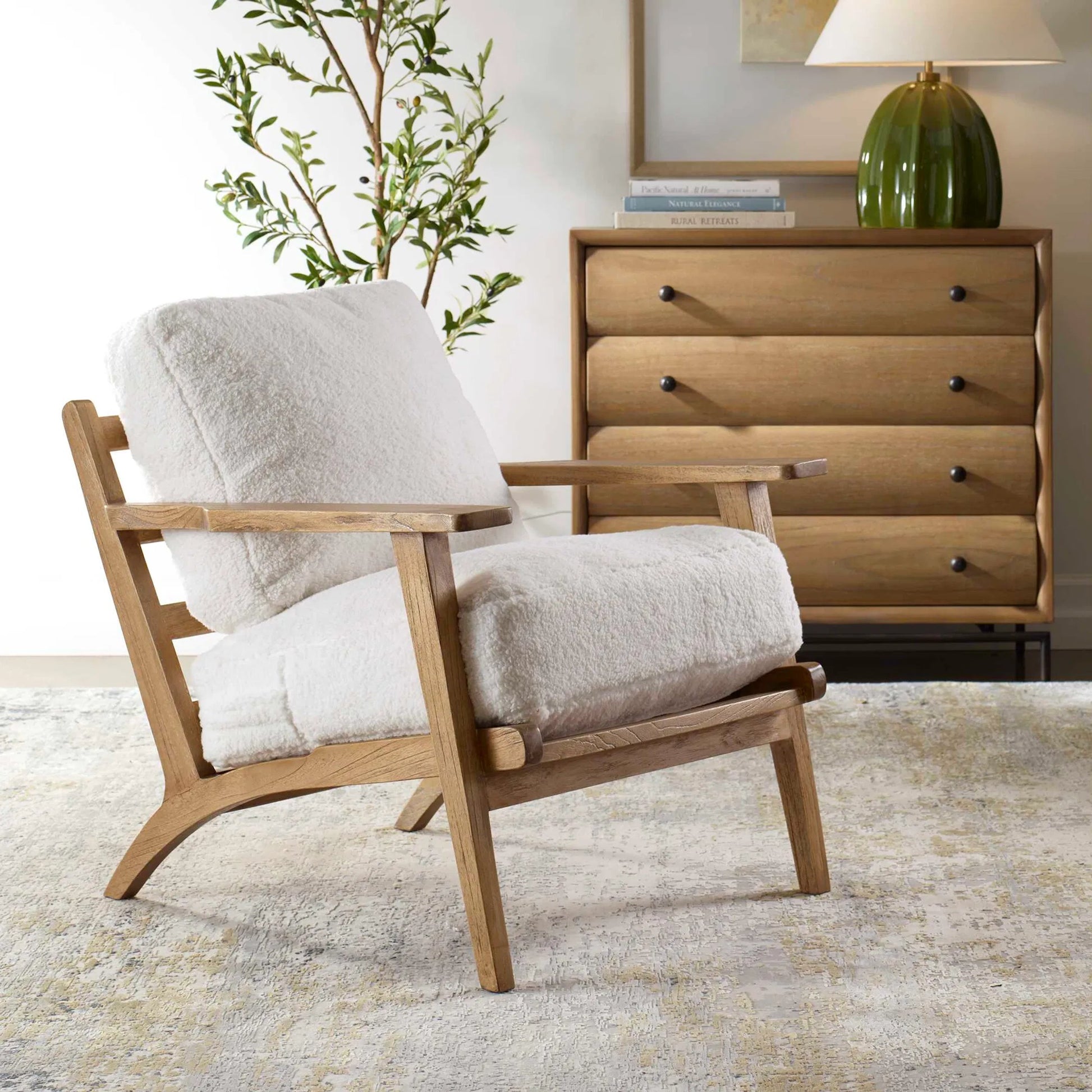Laid Back Sheepskin Accent Chair by Uttermost in white. Made from mindi wood, fabric bopep in a transitional style.