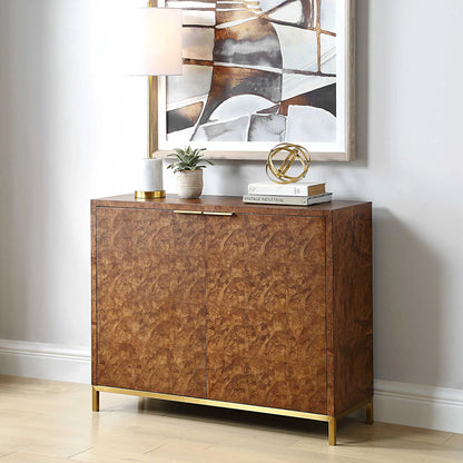 Jethro Burl 2 Door Cabinet by Uttermost in gold. Made from plywood, stainless steel, hardwar, burl veneer in a transitional style.