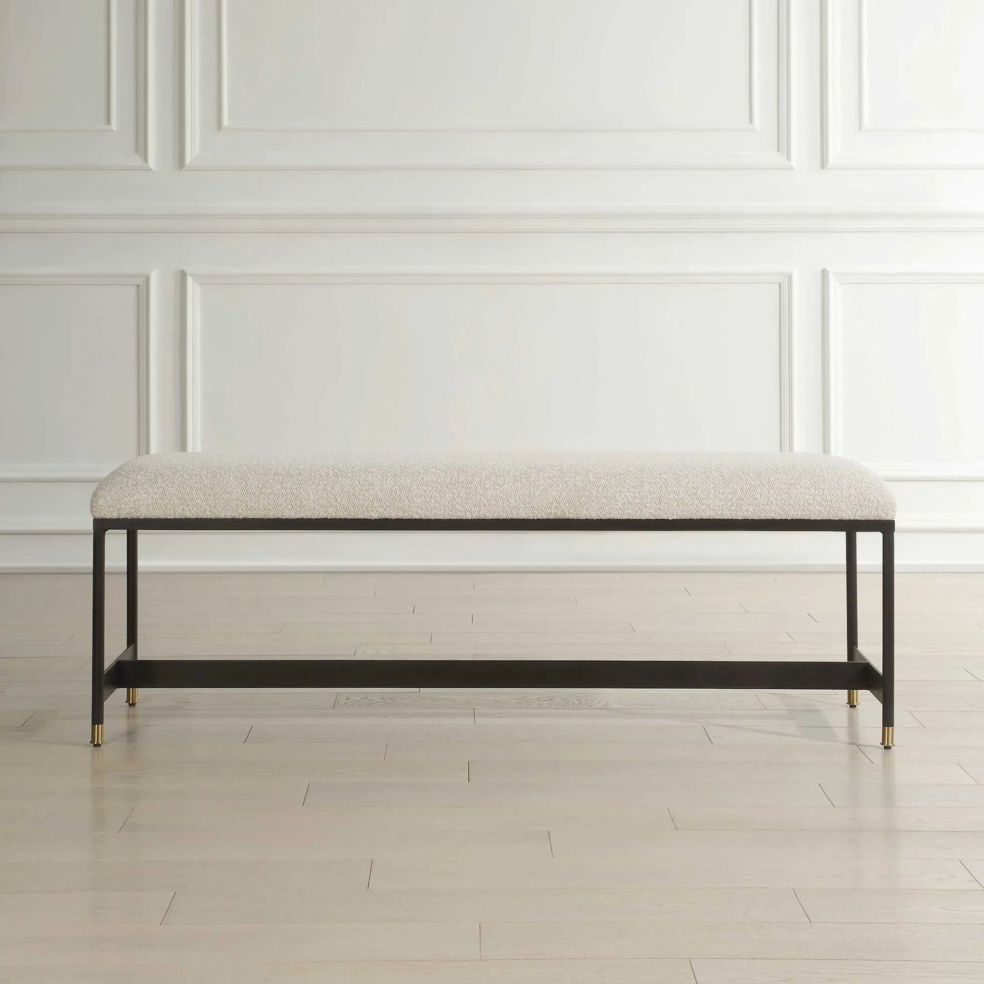 Halston Upholstered Bench by Uttermost in matte black, brass. Made from iron, mdf, foam, fabric in a transitional style.