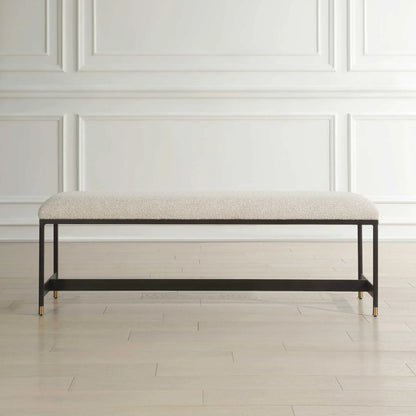 Halston Upholstered Bench by Uttermost in matte black, brass. Made from iron, mdf, foam, fabric in a transitional style.