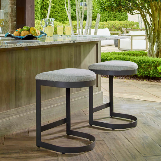 Maude Outdoor Counter Stool by Uttermost in black. Made from stainless steel, fabric cloud dancer in a unique style.
