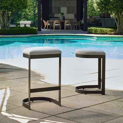 Maude Outdoor Bar Stool by Uttermost in black. Made from stainless steel, fabric cloud dancer in a transitional style.