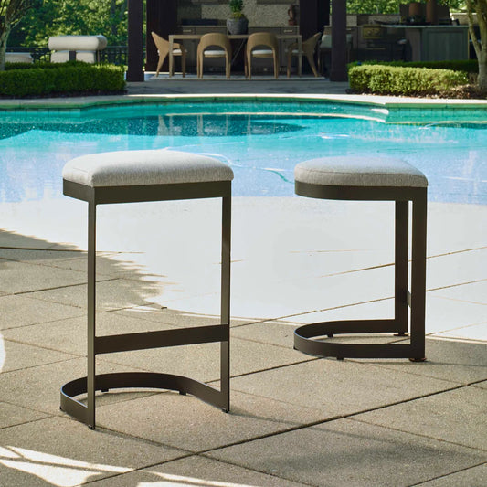 Maude Outdoor Bar Stool by Uttermost in black. Made from stainless steel, fabric cloud dancer in a unique style.