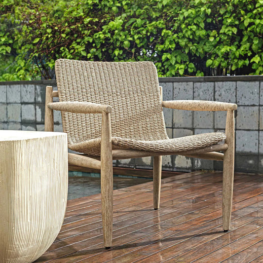 Sumba Wicker Outdoor Lounge Chair by Uttermost in wheat. Made from mahogani wood, wicker in a unique style.