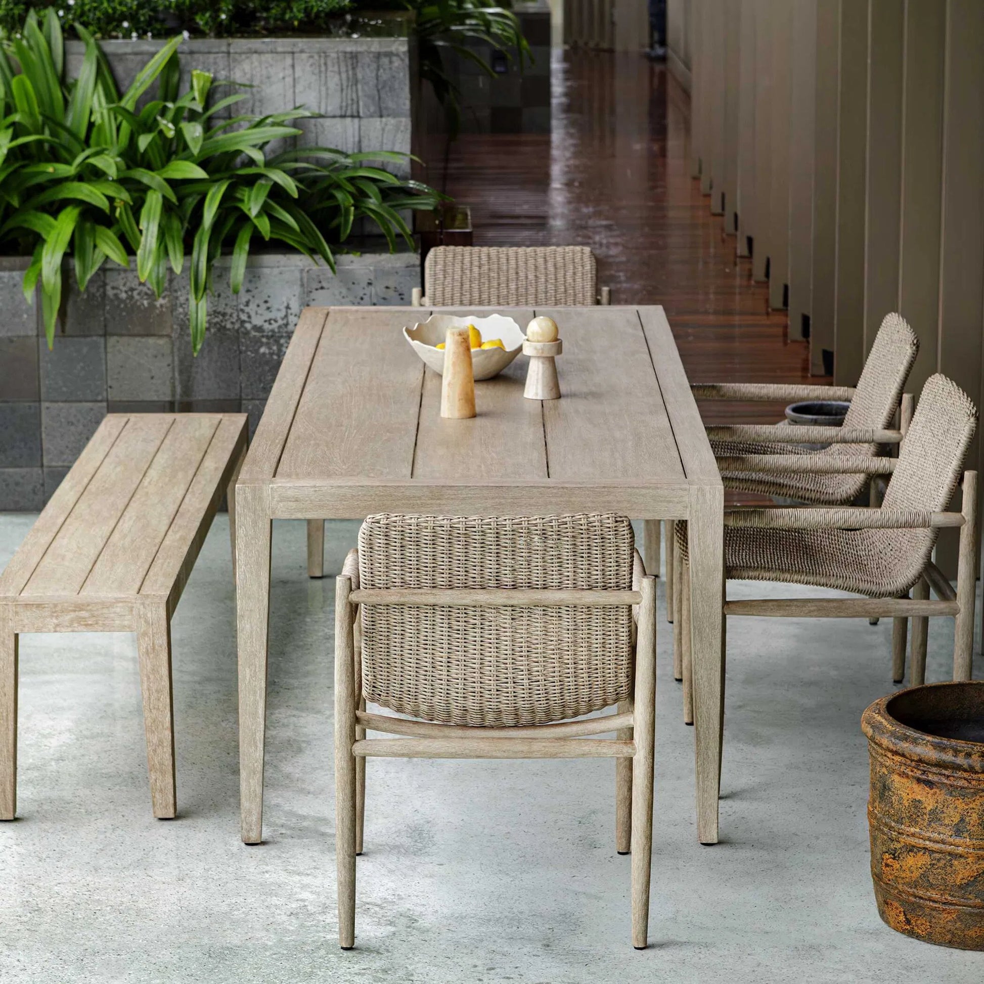 Kirkham Outdoor Dining Table by Uttermost in wheat. Made from mahogani wood in a transitional style.