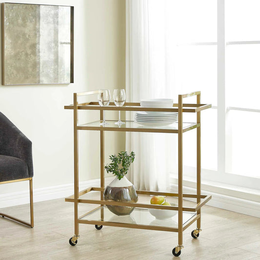 Erena Bar Cart by Uttermost in brass. Made from stainless steel, tempered glass in a unique style.