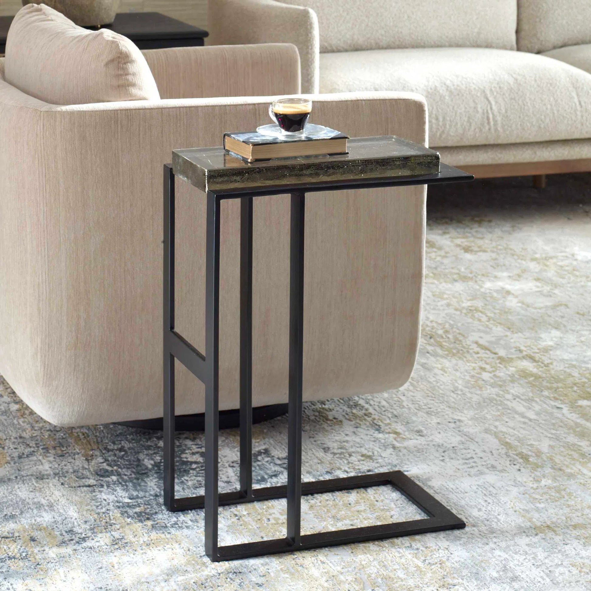 Soma Accent Table by Uttermost in black. Made from glass, metal in a unique style.