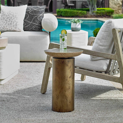 Oslo Outdoor Accent Table by Uttermost in brass. Made from metal, travertine in a modern style.