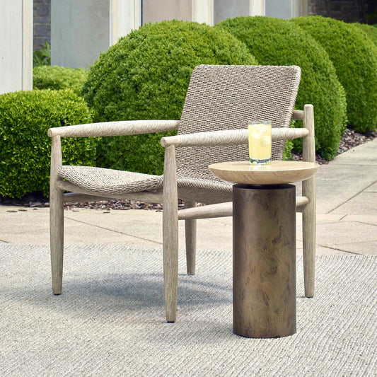 Oslo Outdoor Accent Table by Uttermost in brass. Made from metal, travertine in a unique style.