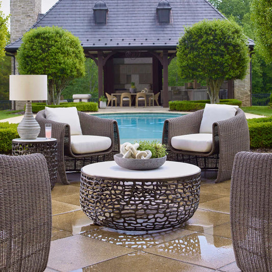 Sabena Outdoor Coffee Table by Uttermost in dark bronze. Made from metal, white banswara marble in a unique style.
