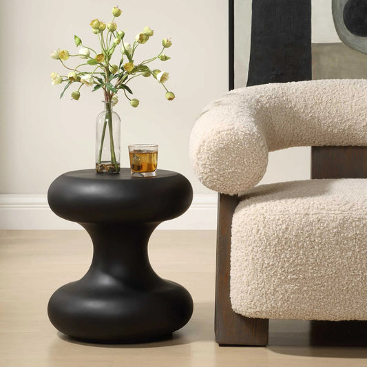 Robles Outdoor Accent Table by Uttermost in black. Made from rice-stone resin in a unique style.
