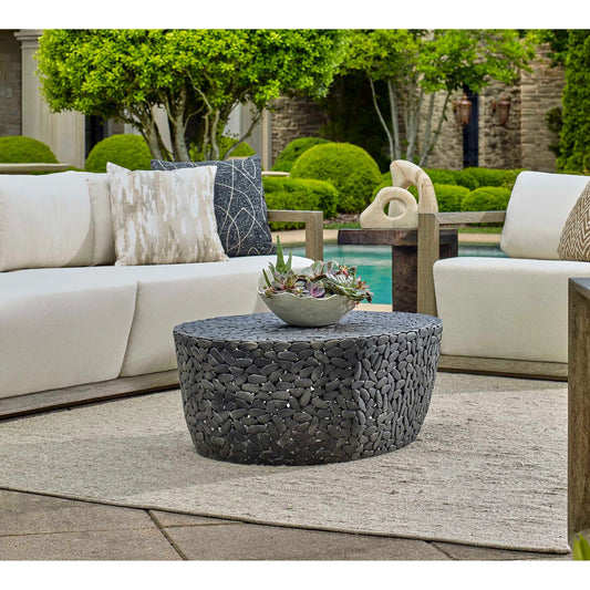 Rivington Outdoor Pebble Coffee Table by Uttermost in black. Made from aluminium in a unique style.