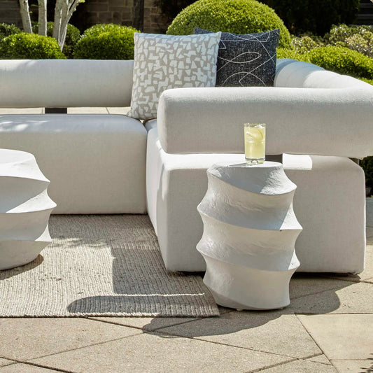 Winded Outdoor Accent Table by Uttermost in white. Made from glass fiber reinforced concrete in a unique style.