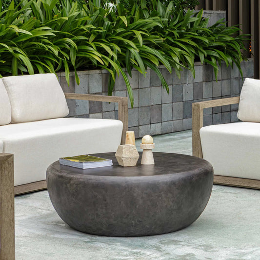 Jones Outdoor Coffee Table by Uttermost in dark stone. Made from javamix wood, plywood with resin in a unique style.