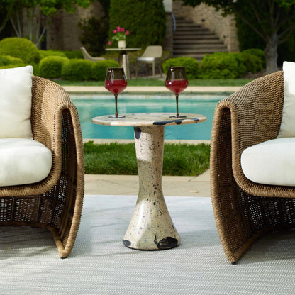 Cadas Indoor/Outdoor Side Table by Uttermost in black, white and black. Made from coral stone, black resin in a unique style.
