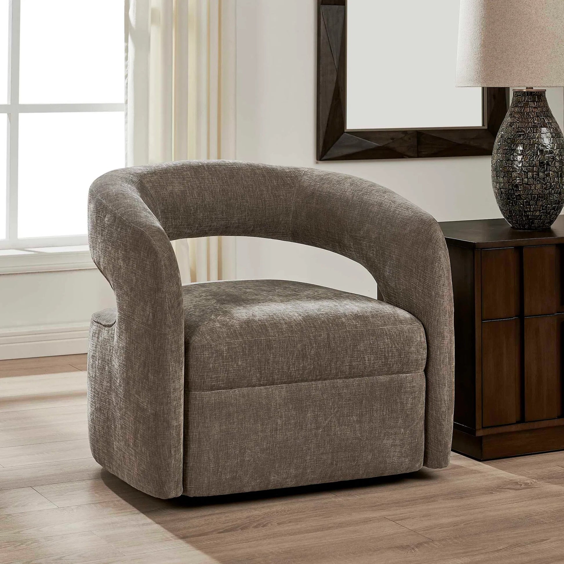 Breis Swivel Barrel Chair by Uttermost in gray and taupe. Made from plywood:, fabric :, foam:, swivel metal in a unique style.