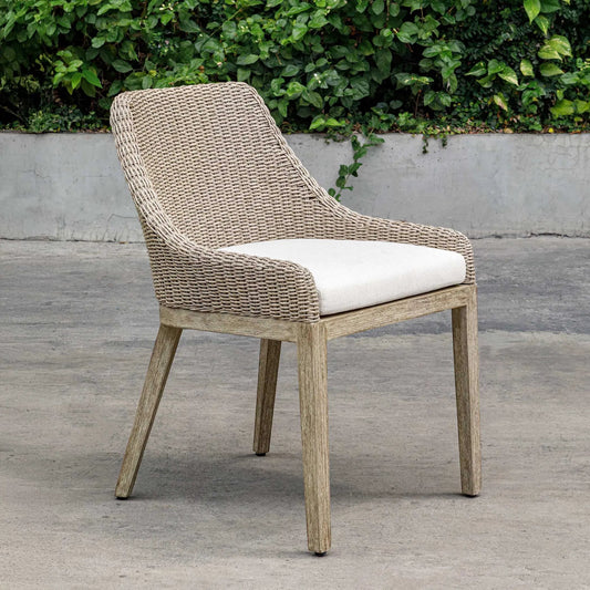 Paloma Outdoor Wicker Dining Chair by Uttermost in gray and white. Made from mahogany wood, aluminum with wicker in a unique style.