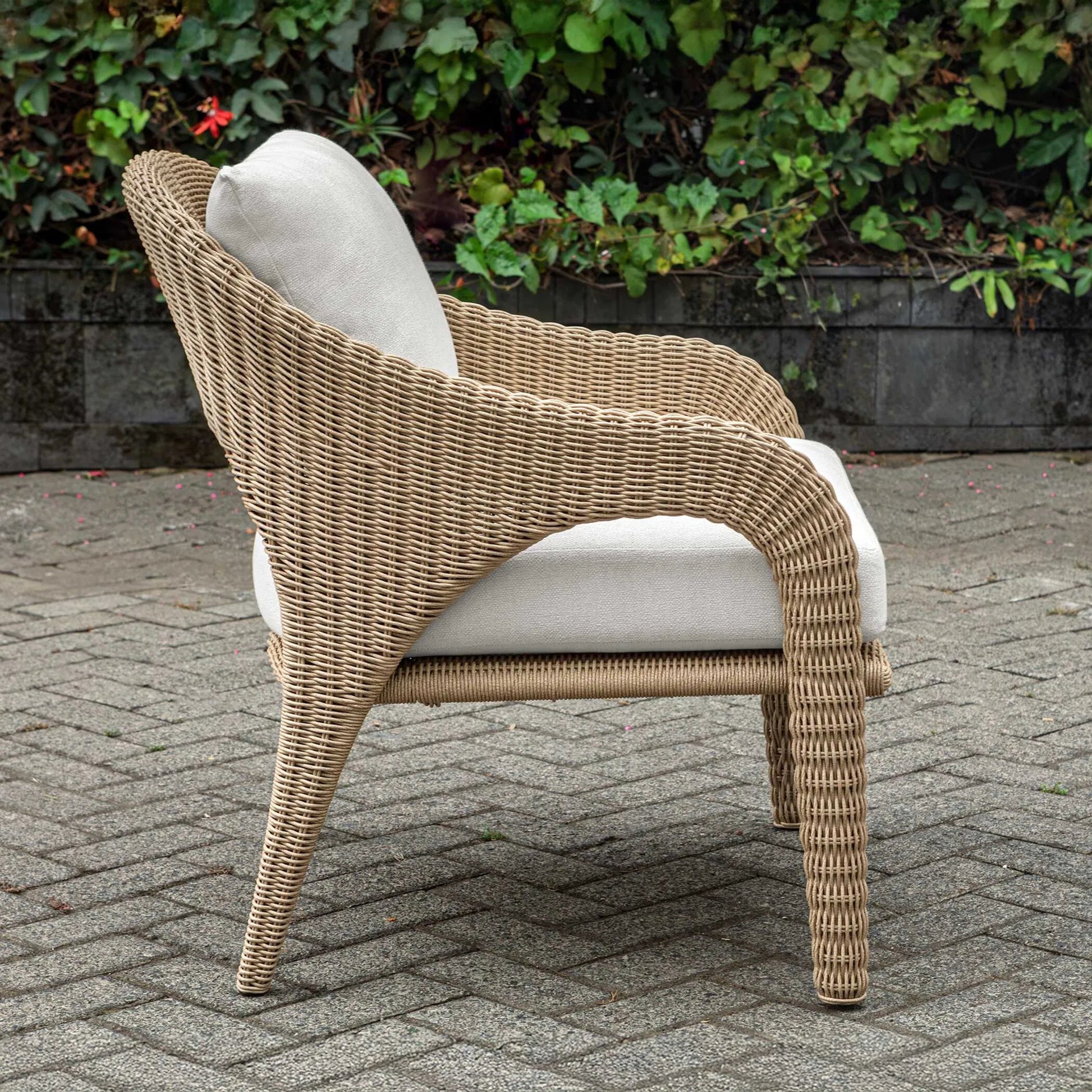 Kavali Outdoor Wicker Lounge Chair by Uttermost in white and natural honey. Made from wicker twist 3mm riviera, fabric crescent cloud dancer in a unique style.