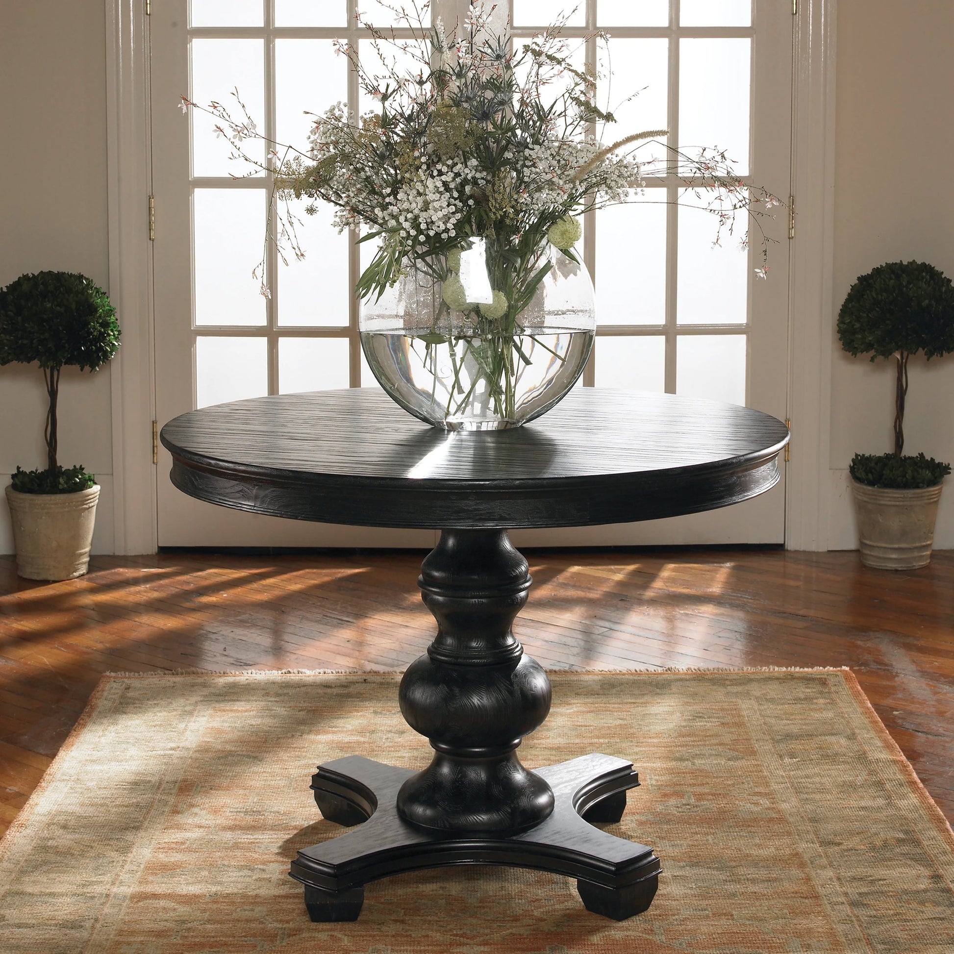 Brynmore Round Table by Uttermost. Made from wood, mdf, pu leather in a cottage & farmhouse style.