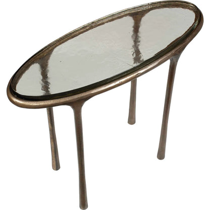 Ata Oval Accent Table by Uttermost in brass and brass. Made from aluminium, cast glass in a unique style.