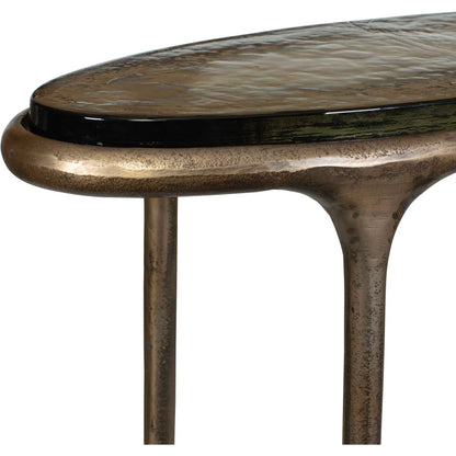 Ata Oval Accent Table by Uttermost in brass and brass. Made from aluminium, cast glass in a unique style.