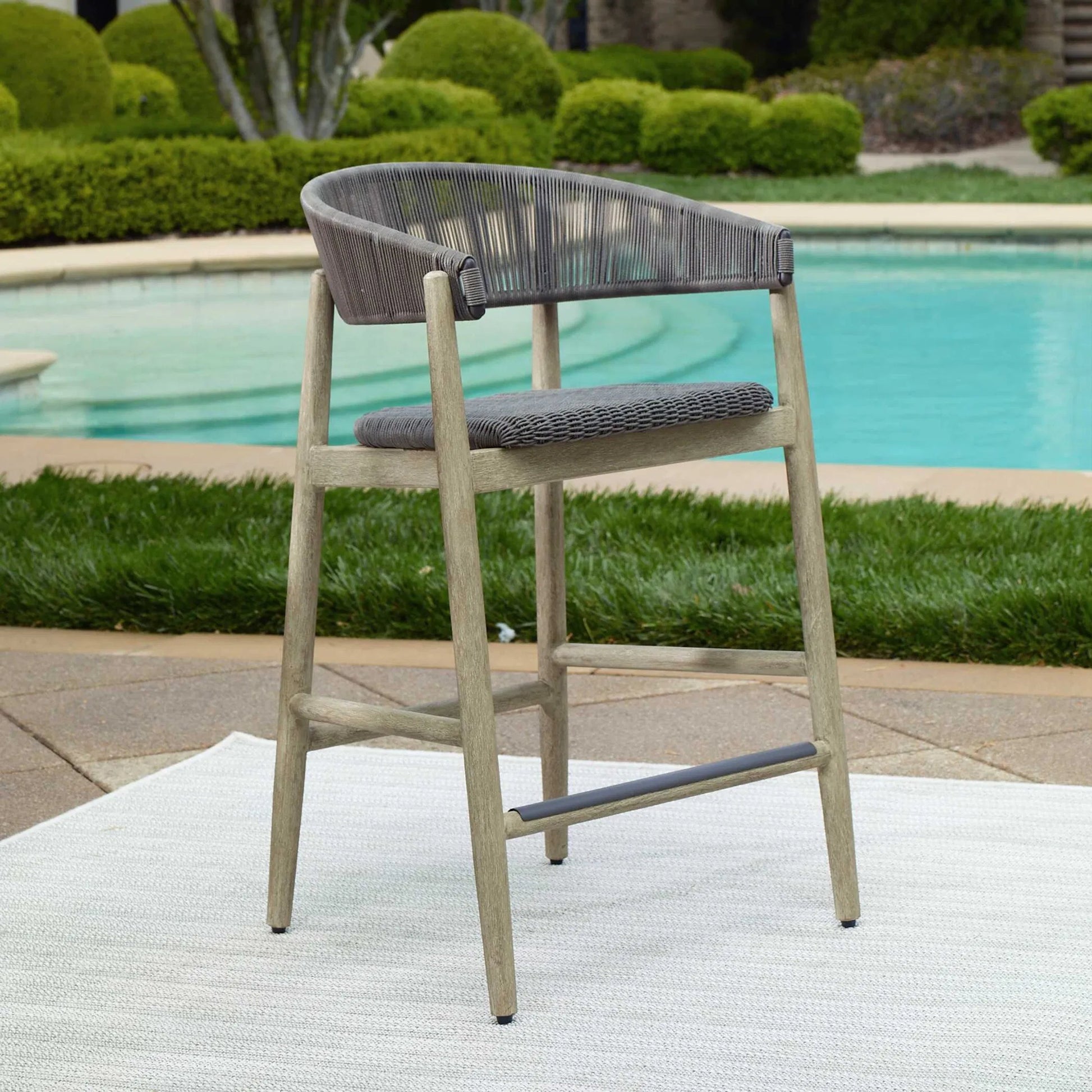 Dermott Indoor/Outdoor Counter Stool by Uttermost in brown and mahogany. Made from mahogany wood, wicker k-rod tera brown 3mm in a unique style.
