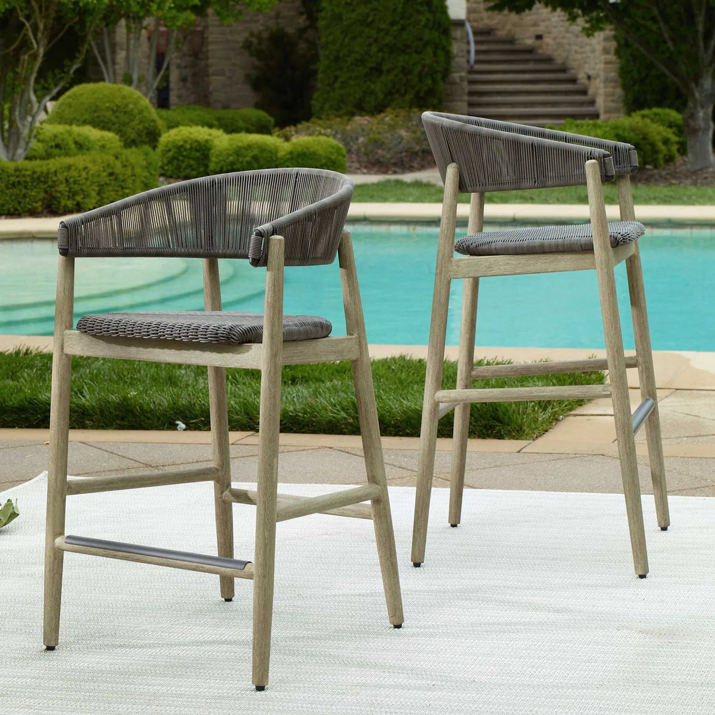 004 SI-2630765 | Unknown | Dermott Indoor/Outdoor Bar Stool by Uttermost in brown and mahogany. Made from mahogany wood, wicker k-rod tera brown 3mm in a unique style.