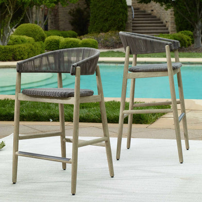 Dermott Indoor/Outdoor Bar Stool by Uttermost in brown and mahogany. Made from mahogany wood, wicker k-rod tera brown 3mm in a unique style.