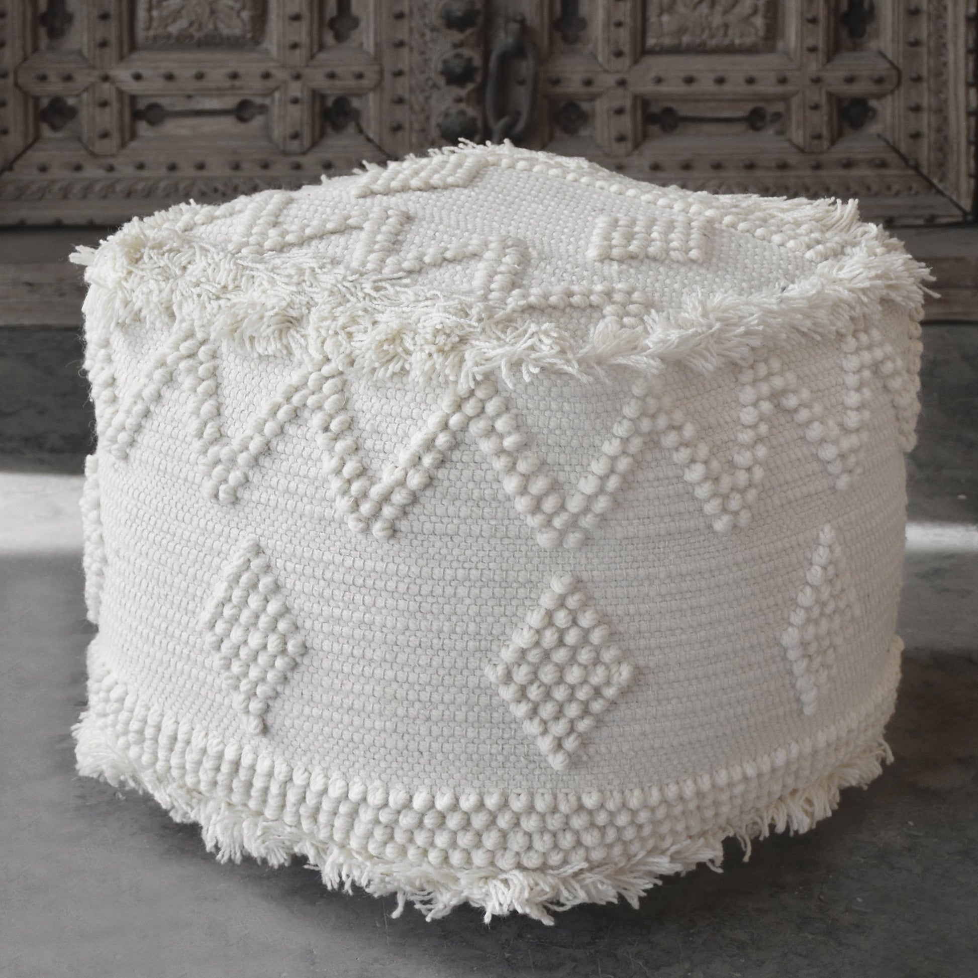 Uriah Ivory Pouf by Uttermost. Made from wool, cotton in a eclectic & global style.